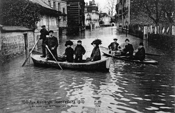 6 of 64 Photo in Gallery: After an unusually rainy summer and fall&nbsp;in 1909, water levels in Paris were alarmingly high. The situation became a crisis in January 1910, when the French capital flooded. Thousands of people were evacuated, while those that stayed had to travel by boat or across wooden walkways that were erected over the submerged streets. The floods lasted for two months and five people lost their lives.