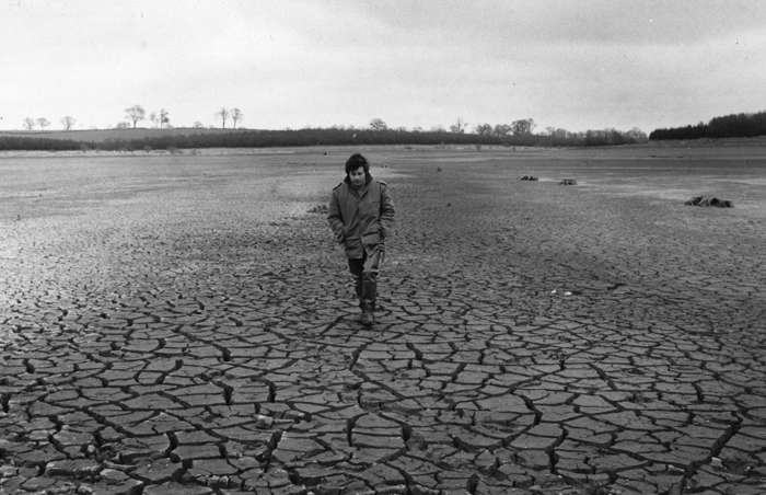 40 of 64 Photo in Gallery: The UK suffered its worst drought in 150 years in 1976. A record hot summer and a lingering high pressure system saw temperatures reach above&nbsp;85°F (30°C) for 18 consecutive days. Despite the delight of months of sunshine and blue skies, the country’s hottest summer in centuries meant water supplies reached dangerously low levels – so much so that a Minister for Drought was appointed. This photograph shows a man walking through Pitsford Reservoir in Northants, which completely dried up.