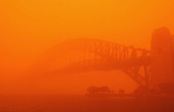 57 of 64 Photo in Gallery: An ominous red haze hung over Sydney in September 2009, after severe winds in New South Wales blew in red dust from the state’s drought-ravaged interior. The strange and unusual weather saw flights grounded, ferries suspended and Sydneysiders choking in the polluted air. Luckily, the thick orange smog dissipated within a couple of days.  Check out these mind-blowing&nbsp;facts about the weather