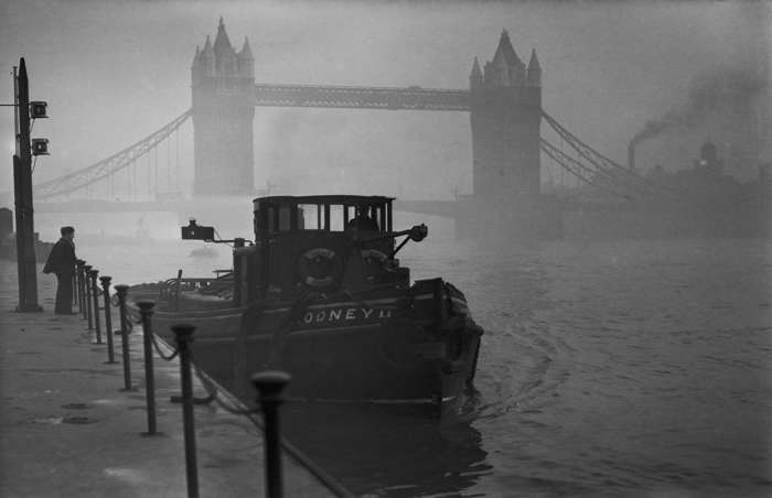 28 of 64 Photo in Gallery: Another dramatic weather event saw post-war Britain suffer more causalities, when a toxic smog choked London on 5 December 1952. The smog, a result of fog combining with sulfurous coal smoke, could not disperse upwards due to a high-pressure weather system trapping the stagnant and soot-laden air. It lasted for five days, paralyzed the city and is thought to have led to the premature deaths of at least 4,000 people. The Clean Air Act was introduced as a direct result of the crisis.