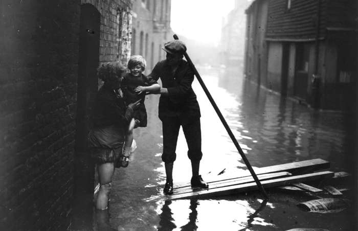 15 of 64 Photo in Gallery: A storm surge, sent up the River Thames by a depression in the North Sea on 7 January 1928, saw the moat at the Tower of London fill for the first time in 80 years. Floodwaters engulfed some of the capital’s most historic buildings, including the Houses of Parliament. The flood also hit much of the city's poorest and most crowded basement dwellings. Fourteen people died and many became homeless after the tidal surge.&nbsp;