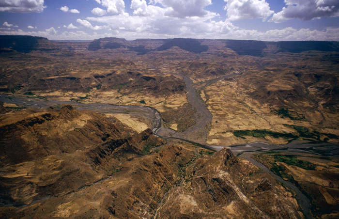 42 of 64 Photo in Gallery: A drought and border conflicts in the first half of the 1980s contributed to a major famine in Ethiopia. Northern Ethiopia is a drought-prone part of the world and in this period shortfalls of rain caused repeated failed harvests. According to the United Nations, the food shortages from 1983 to 1985 caused over one million famine deaths and led to hundreds of thousands of people being displaced. This image was taken during the distribution of corn to isolated villages by helicopter in February 1987.