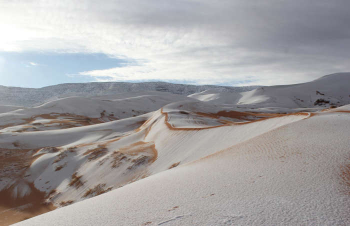 60 of 64 Photo in Gallery: Despite it reaching freezing temperatures at night, snow in the Sahara Desert is very rare. In fact, it snowed there for only the third time in 40 years during the January of 2018. The rare weather event happened near the Algerian town of Aïn Séfra and saw the region's renowned desert dunes covered in a deep layer of perfect white snow.&nbsp;  Here are more of the world's most unexpected weather events