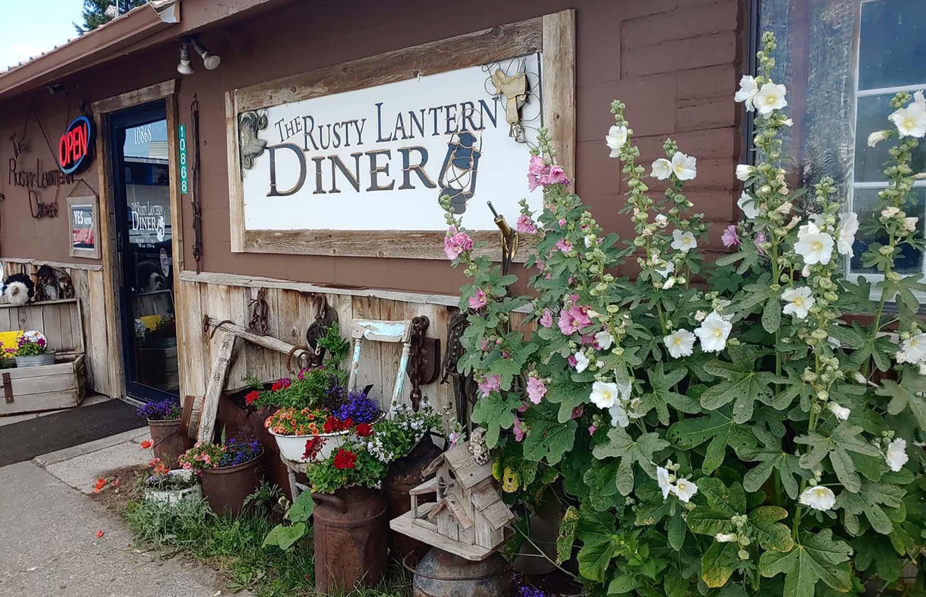 <p>If you’re passing through Ucon on your <a href="https://therustylanterndiner.com/about/">way to Yellowstone,</a> The Rusty Lantern is a cozy spot to stop. Made of wood and surrounded by pots and flowers, it doesn’t look like a traditional diner. But it <a href="https://www.yelp.com/biz/rusty-lantern-diner-idaho-falls?sort_by=date_desc">serves great</a> breakfast skillets featuring hash browns, bacon, cheese, cooked onions and scrambled eggs, prime rib on Friday and Saturday, and ginormous, sticky cinnamon rolls.</p>