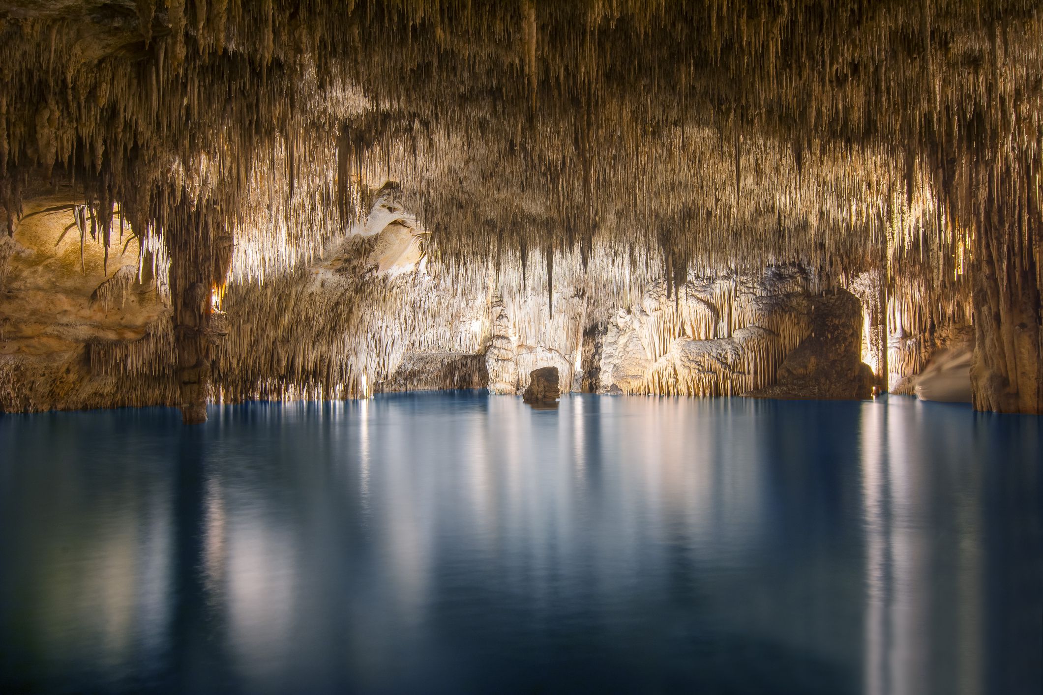 Slide 3 of 52: Located in Mallorca, Spain, the Dragon Caves are home to Lake Martel, one of the largest underground lakes in the world. 