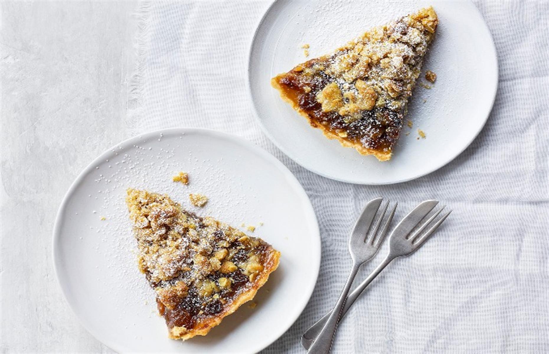 Slide 25 of 31: A different twist on a mince pie, this tart is filled with Christmas mincemeat then covered in a crunchy streusel topping, flavored with the zest of a satsuma (or orange, if you like). Serve it just warm, with plenty of whipping cream. To make it more festive, add a splash of rum or brandy to the cream before whipping. Get the recipe for mince pie streusel tart here