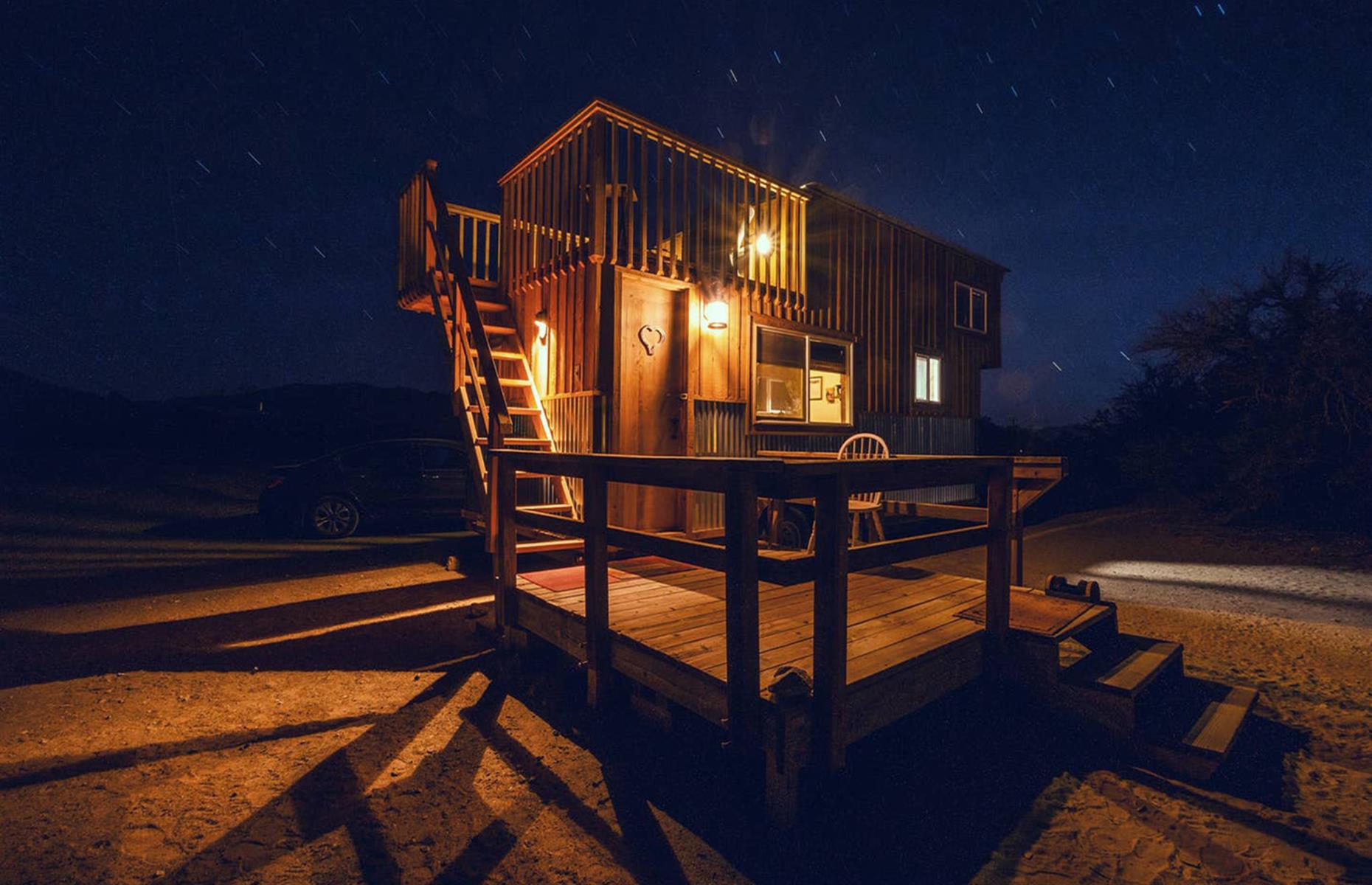 <p>Visitors can leave the shiny city lights behind and enjoy the tranquillity of the Mojave Desert at <a href="https://www.airbnb.co.uk/rooms/16585224">this tiny home</a> located in Sandy Valley. Available to book for $100 a night (bookings for a week or more get a 10% discount), the tiny house has a full bathroom, a comfortable queen-size bed and a stove, however, meals can typically be arranged to be served in the main house (check with the host for current availability). The house also has a rooftop patio for enjoying the colorful desert sunrises and sunsets.</p>