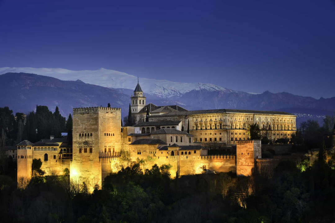 Slide 7 of 58: The Alhambra Palace in Grenada, Andalusia, was built in 889 CE over the ruins of earlier Roman fortifications.