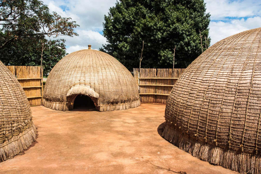 Slide 33 of 58: One of the smallest countries in Africa, Swaziland is known for its homesteads, clusters of traditional beehive huts&nbspcovered with dry grass.
