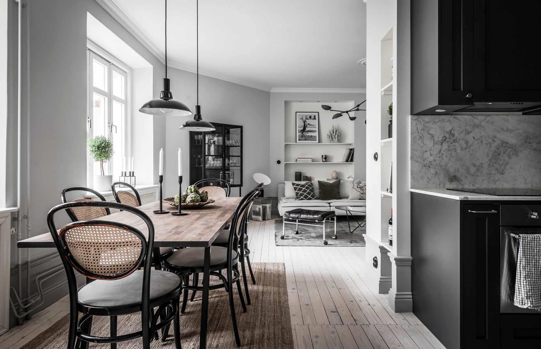 <p>Not every multifunctional living space is square or rectangular – instead of trying to make your room fit into a formulaic open-concept layout, embrace unusual dimensions and create a design that works with the eccentricities of your space. In the U-shaped floor plan of this Scandinavian loft for rent via <a href="https://www.alvhem.com/objekt/nordhemsgatan-45b-linnestaden/">Alvhem</a>, a long dining table fits snuggly in the thoroughfare between the kitchen zone and the lounge.</p>