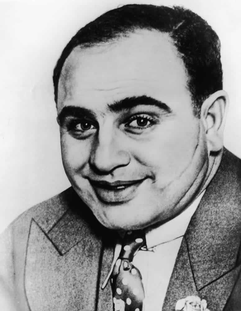 <p>While employed as a night club bouncer by Frankie Yale, another Five Points Gang member, Capone inadvertently insulted a woman while working the door. He was slashed with a knife three times on the left side of his face by the woman's brother, the wounds of which led to the nickname "Scarface," which Capone loathed. From then on he rarely allowed anybody to photograph him from the left side, though this image was captured shortly after the event.</p>