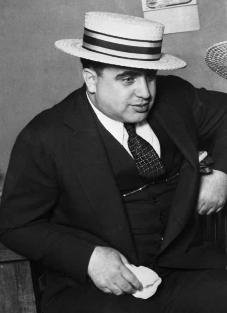 <p>Capone began his new life in Chicago as a bouncer in a brothel, where he contracted syphilis. But this was the Prohibition era and Capone was soon involved with bootleggers in Canada, who helped him smuggle liquor into the US.</p>