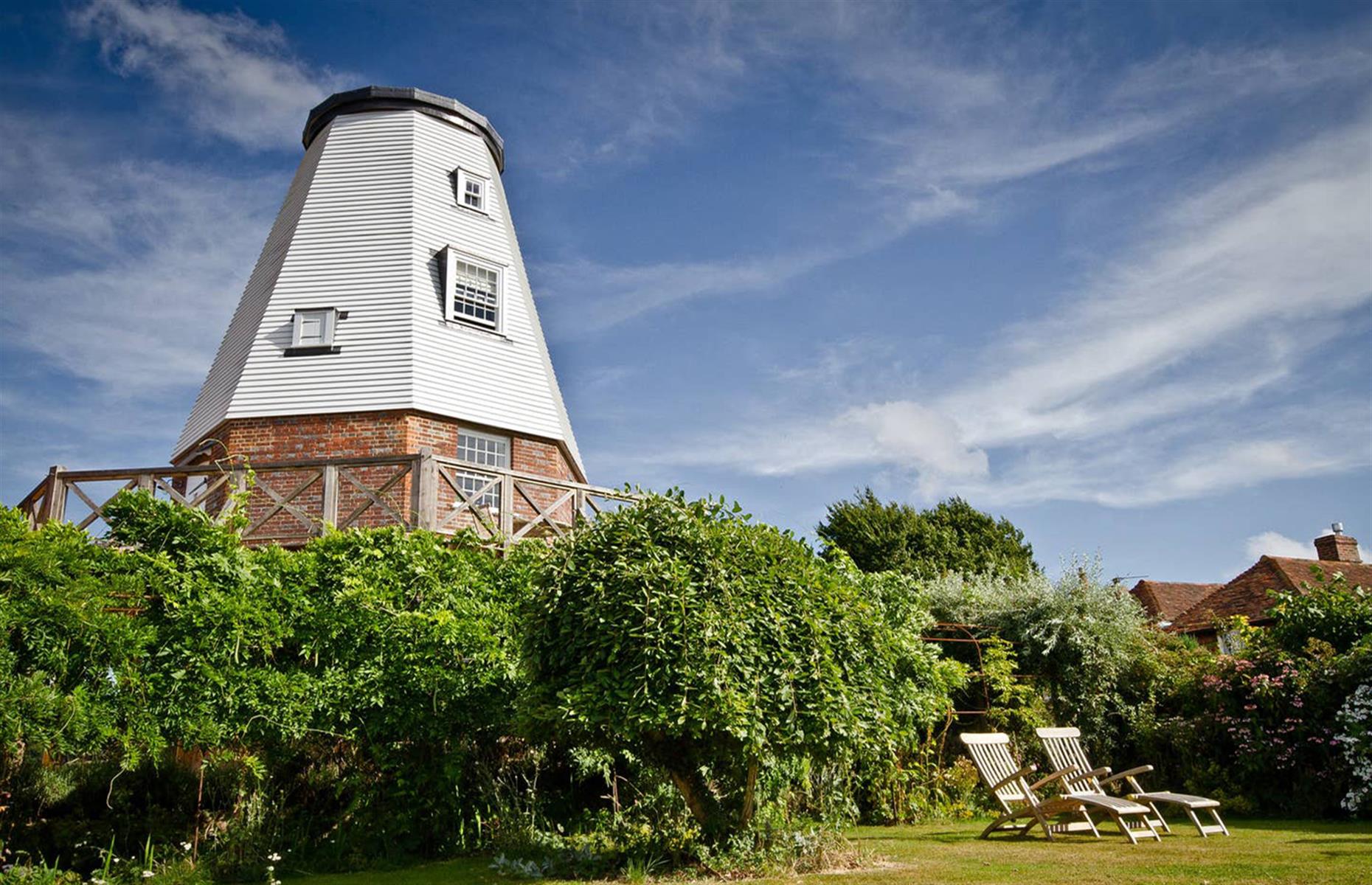 <p>Set in the idyllic Kent countryside in the south of England, <a href="https://www.airbnb.co.uk/rooms/1237965">this old windmill</a> has been beautifully restored. There's one bedroom with a king-sized bed, a fully-equipped kitchen and a cozy living room with a gas wood-burning stove. It's easy to give into the charm of the area and enjoy relaxing rambles before stopping at one of the charming country pubs for a meal. Due to its remote location, the sunrises and sunsets here are stunning.</p>