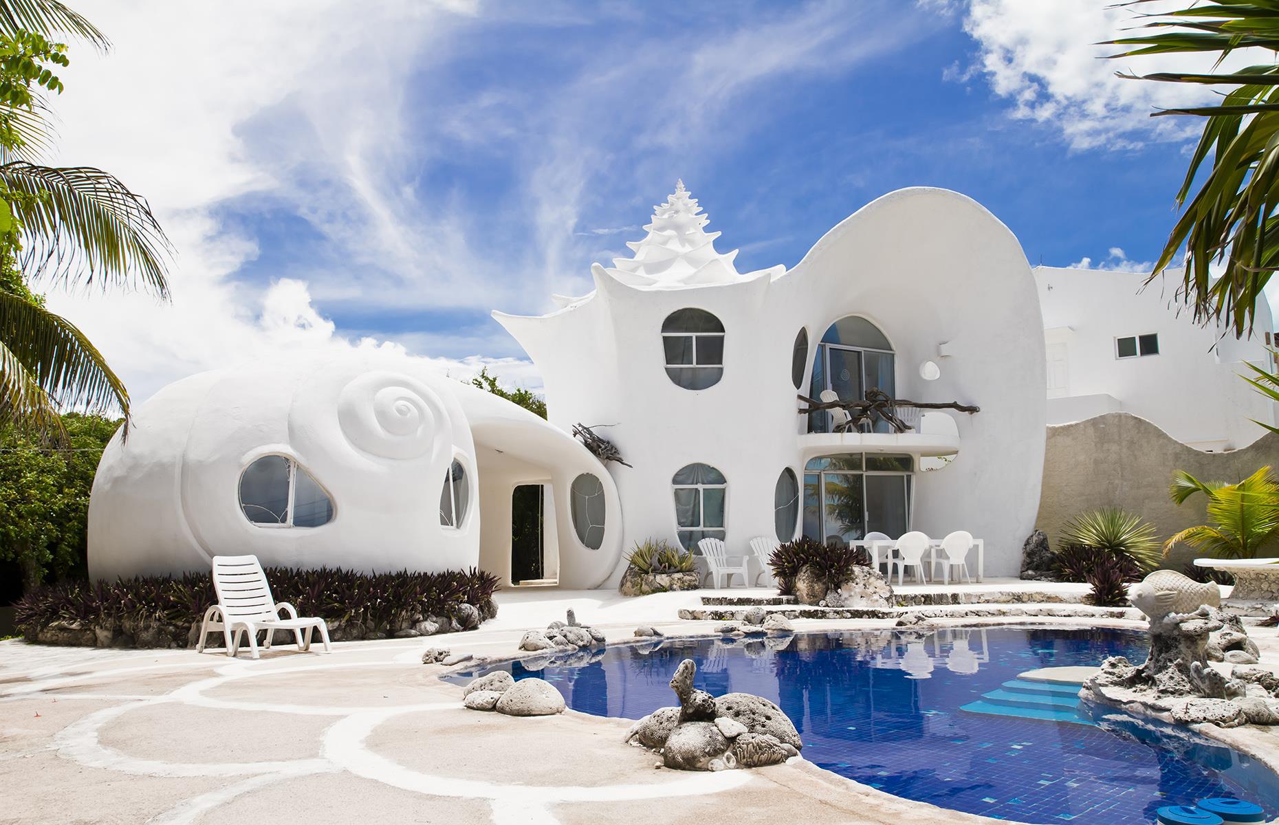 <p>Sleeping inside a seashell on Isla Mujeres, just off the coast of Cancún couldn't be any closer to a storybook experience. It isn’t just <a href="https://www.airbnb.co.uk/rooms/530250">The Seashell House's</a> whitewashed exterior that follows the shell theme – inside, there are shell-encrusted mirrors, sinks and bathrooms. The shower water even sprinkles out from a shell. Outside, there’s a private pool or you can hop into a golf buggy for a 15-minute drive to the beach.</p>