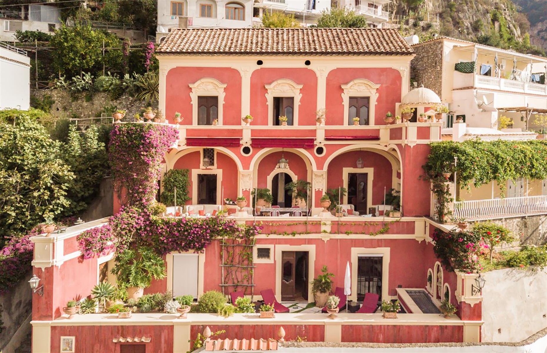 <p>Clinging to a clifftop in the picturesque Italian village of Positano, <a href="https://www.airbnb.co.uk/luxury/listing/26202370">Villa Dorata</a> is a vision in pink. The dreamy four-bedroom villa is surrounded by fragrant citrus trees and overlooks the rugged Mediterranean coastline. The Baroque-style home has ornate fresco ceilings, tiled floors and even a private spa with a Turkish steam bath.</p>