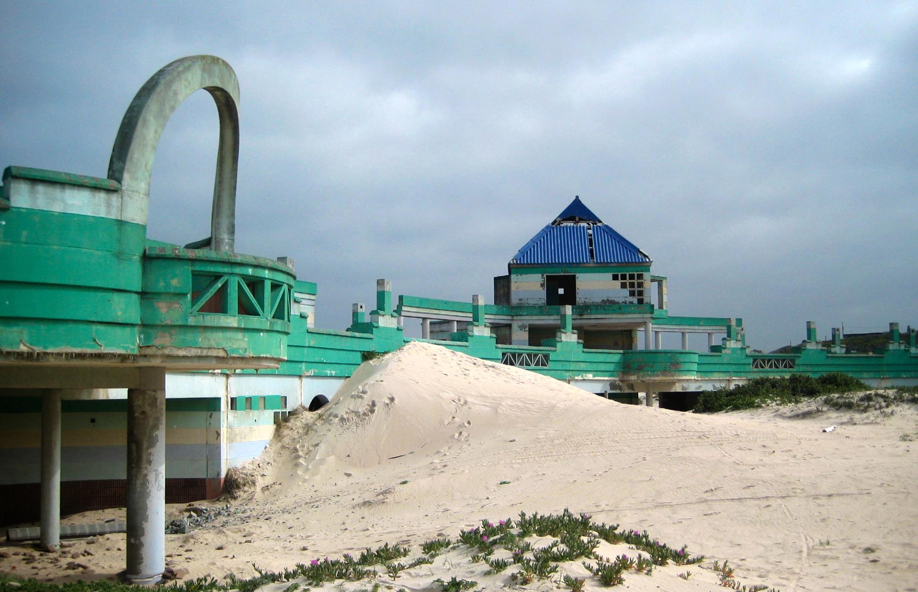 The Macassar Dunes Reserve spreads out for more than 2,000 acres, and is home to ever-shifting sand mountains and a bounty of wildlife. It's also host to the remains of an abandoned water park, Macassar Beach Pavilion. First opened in the Nineties, the park was subsequently closed and deserted. Today its slides, pavilions and walkways are swallowed by the sand.