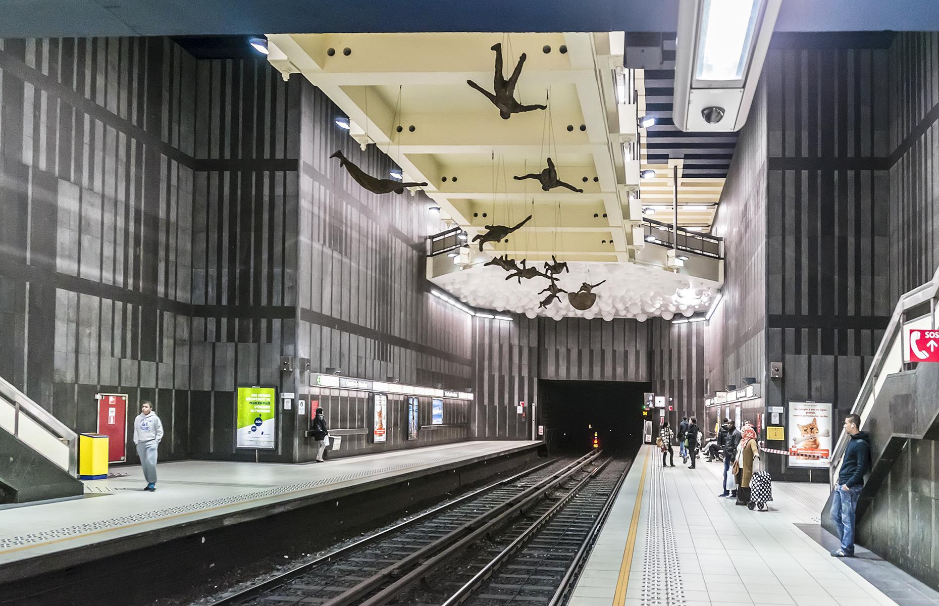 <p>When leaving the train at this station don’t forget to look up: tilt your head and you’ll find 16 mannequins suspended from the ceiling. Created by artist Paul van Hoeydonck, the installation titled <em>16 x Icarus</em> looks eerily realistic.</p>