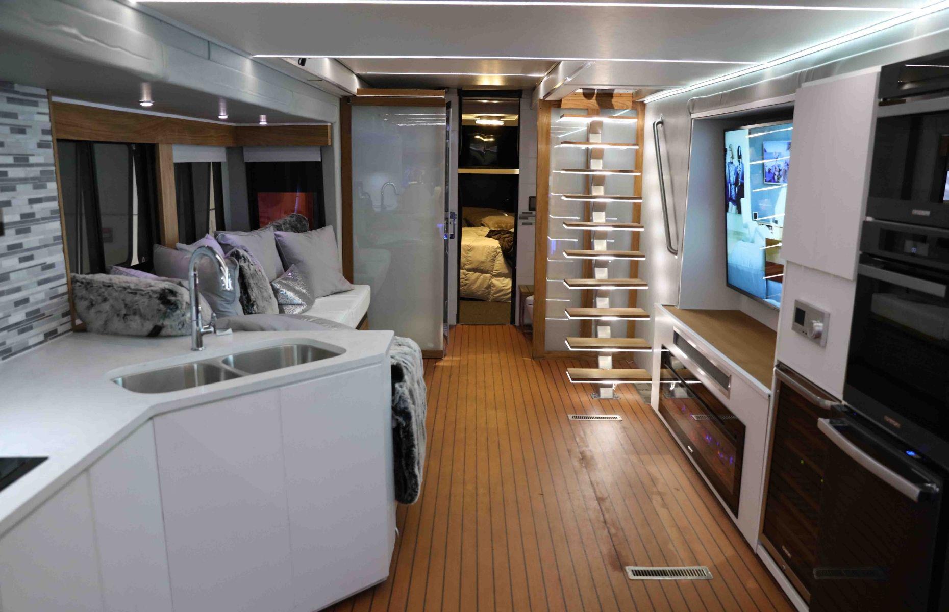 Unsurprisingly, the interior of the concept RV is equally as impressive as the exterior, thanks to its state-of-the-art kitchen, 75-inch TVs, top-of-the-line surround sound system, atmospheric mood lighting, French doors and wine fridge.