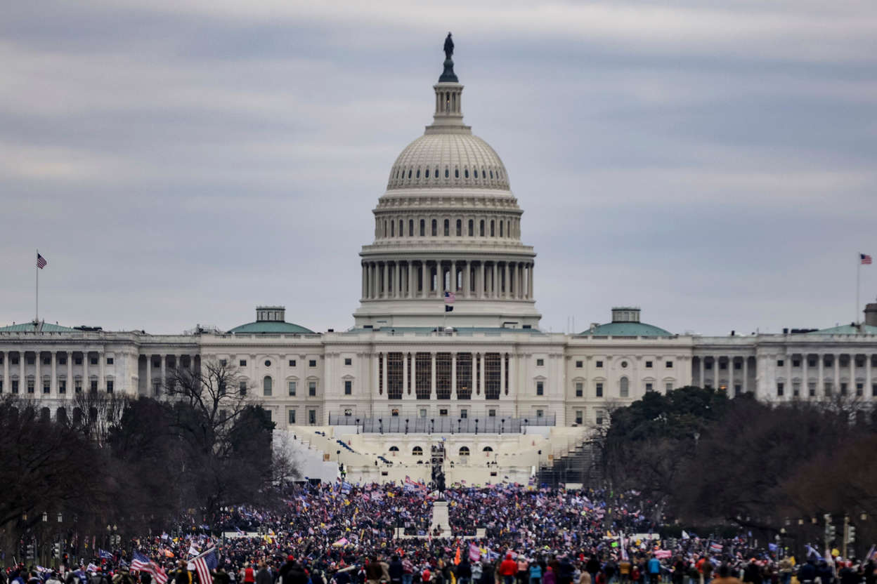 Slide 48 of 76: Supporters of President Donald Trump surround the U.S. Capitol following a rally on Jan. 6, 2021 in Washington, DC.