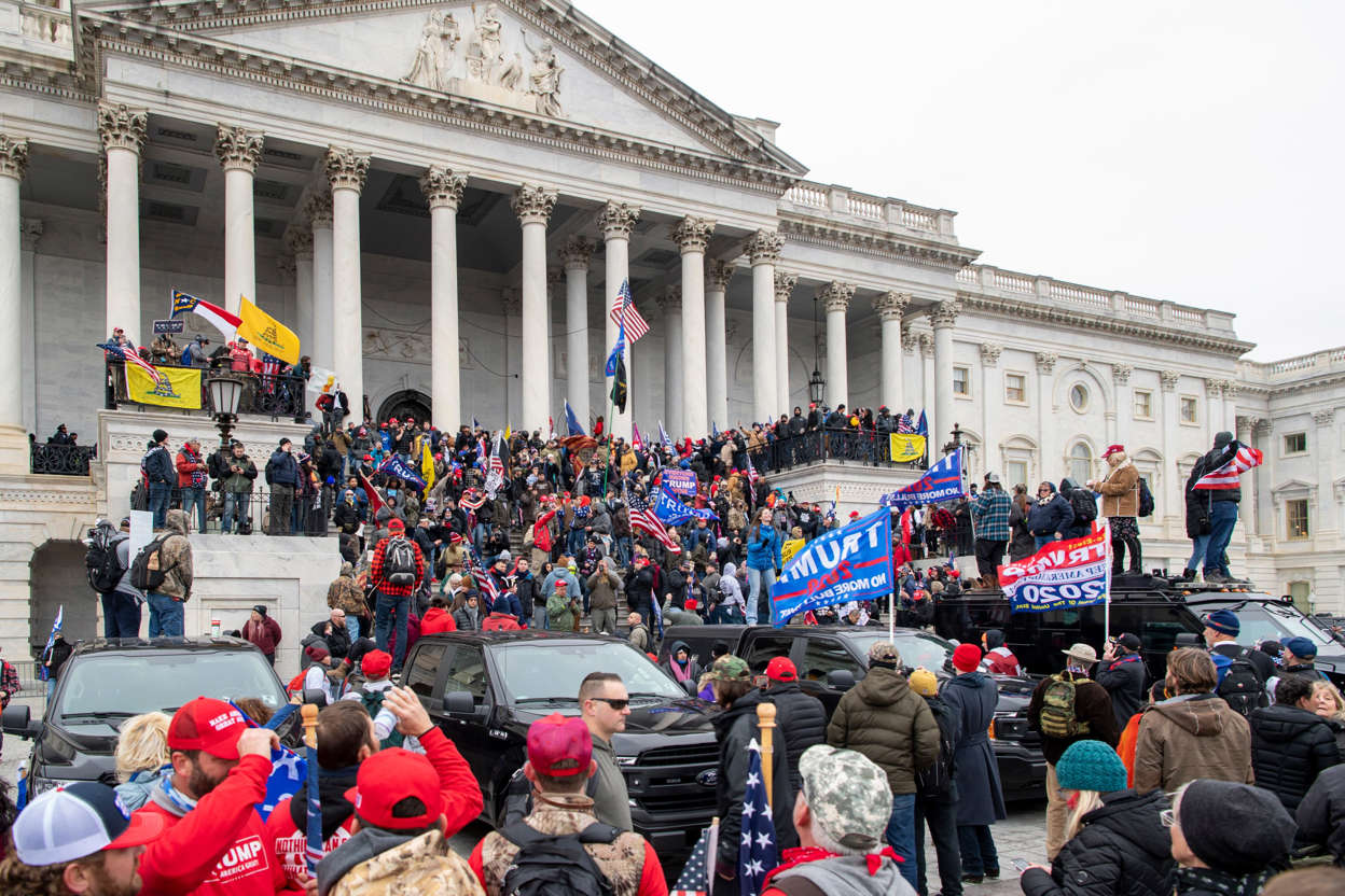 Slide 50 of 76: Rioters swarm the U.S. Capitol building following a Trump protest in Washington, DC on Jan. 6, 2021.