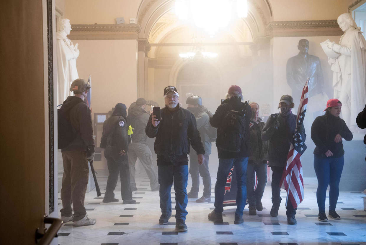 Slide 7 of 76: Pro-Trump rioters protest inside the US Capitol on Jan. 6, 2021, in Washington, DC. - Demonstrators breeched security and entered the Capitol as Congress debated the a 2020 presidential election Electoral Vote Certification.