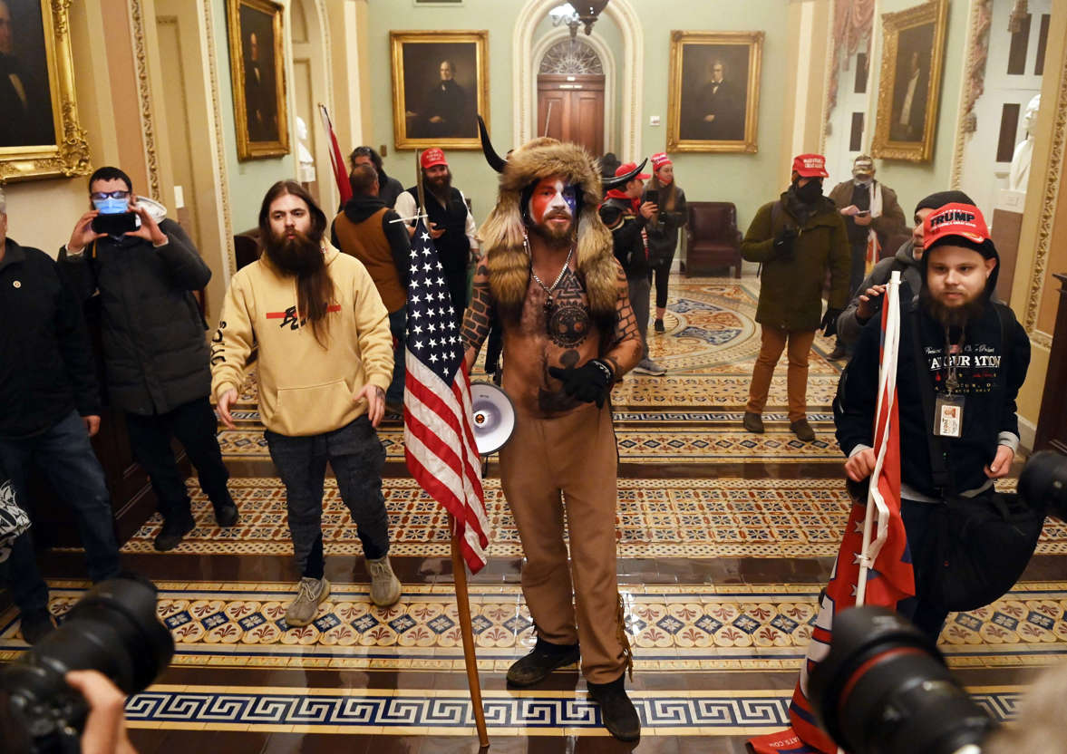 Slide 39 of 76: Supporters of US President Donald Trump enter the US Capitol on January 6, 2021, in Washington, DC.