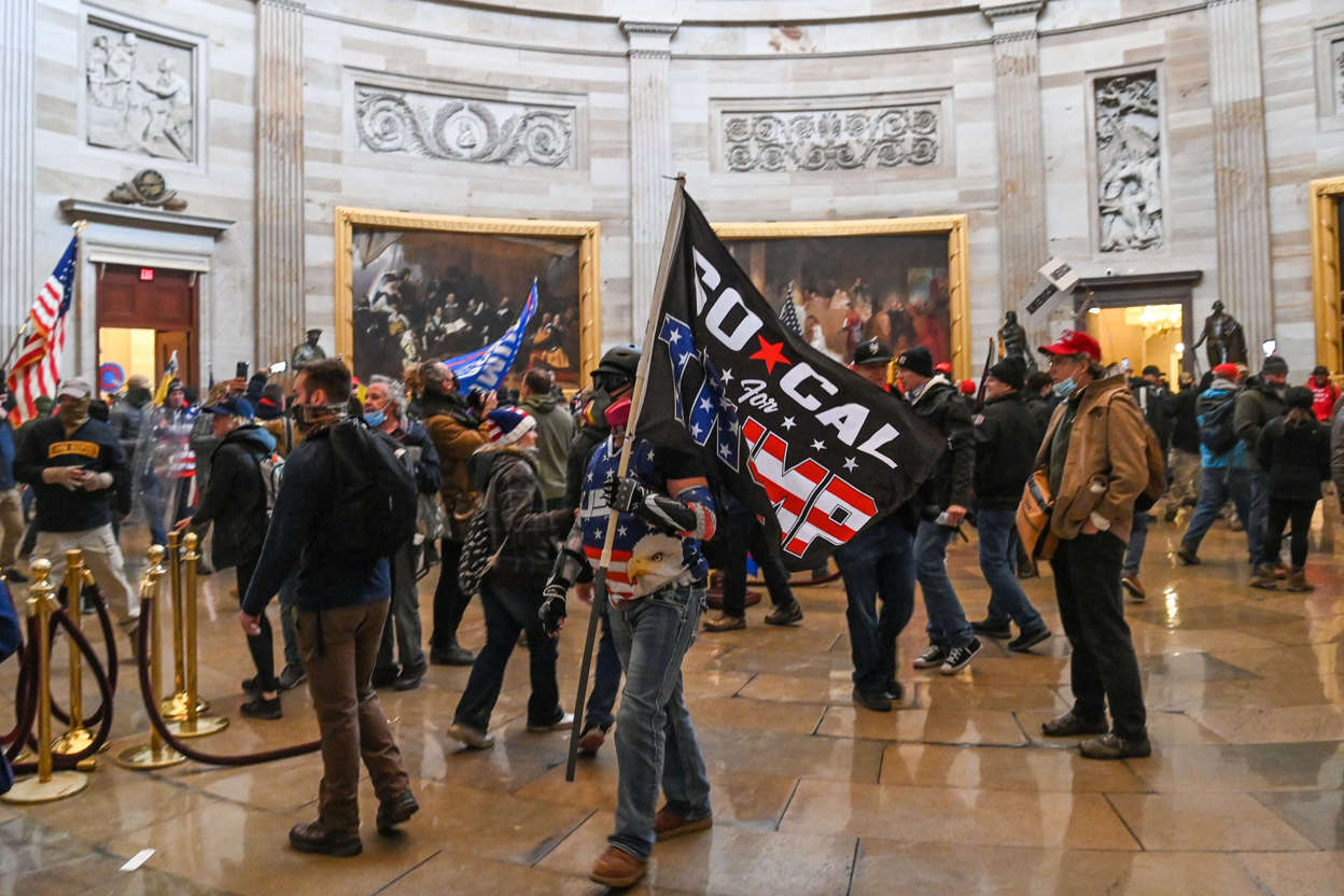 Slide 5 of 76: Pro-Trump rioters roam under the Capitol Rotunda after invading the Capitol building on Jan. 6, 2021, in Washington, DC. Demonstrators breached security and entered the Capitol as Congress debated the 2020 presidential election Electoral Vote Certification.