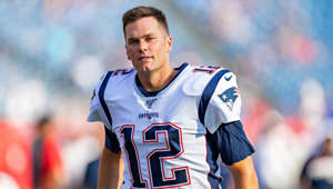 a baseball player holding a football ball: Minutes before his very first Super Bowl game in 2002, Brady fell asleep by his locker. The athlete once recounted in an NFL Films documentary that he took his shoulder pads off and laid down in front of his locker, he said: “I wasn't intending to sleep, but I think I dozed off for 20 or 30 minutes. I just felt good about where I was at. It wasn't like I was so relaxed, I didn't realise the importance of the game. I just felt like I was very prepared.” Brady woke up with 12 minutes to spare before the team ran onto the field. He was filling in for the injured Drew Bledsoe for the first time, and led the team to their first Super Bowl victory.