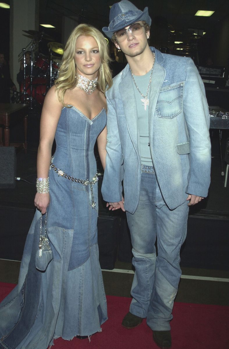 <p>Britney Spears and Justin Timberlake coordinate in <a href="https://www.harpersbazaar.com/celebrity/latest/a35394165/justin-timberlake-talks-double-denim-britney-spears-moment/">matching denim outfits</a> at the 28th American Music Awards. During a recent roundtable for <a href="https://www.hollywoodreporter.com/features/songwriter-roundtable-justin-timberlake-mary-j-blige-janelle-monae-and-more-hitmakers-share-pandemic-reflections-and-keeping-hope-alive-in-2021"><em>The Hollywood Reporter</em></a>, Timberlake said,"I confess that there was maybe a period in the'90s where I could skip over some of the outfits that were public, but the Internet will never." John Legend retorted,"Denim on denim on denim on denim that will never be forgotten!"</p>
