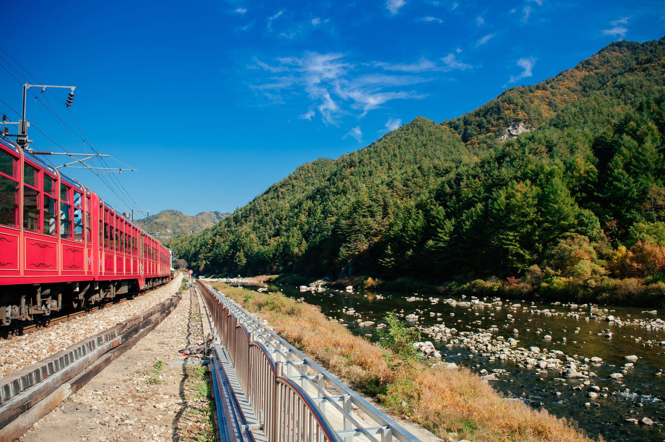 <p>South Korea’s Korail offers a variety of train routes for traversing different parts of the country while enjoying the scenery along the way. The V-Train follows a route through different valleys in a mountainous region of the country between Buncheon and Cheoram.</p><p>Three observatory cabins provide ample space to enjoy the passing scenery and there’s a mini cafe if you need refreshment. The V-Train runs at a slower pace than typical transporter trains so you can take your time with sightseeing.</p>