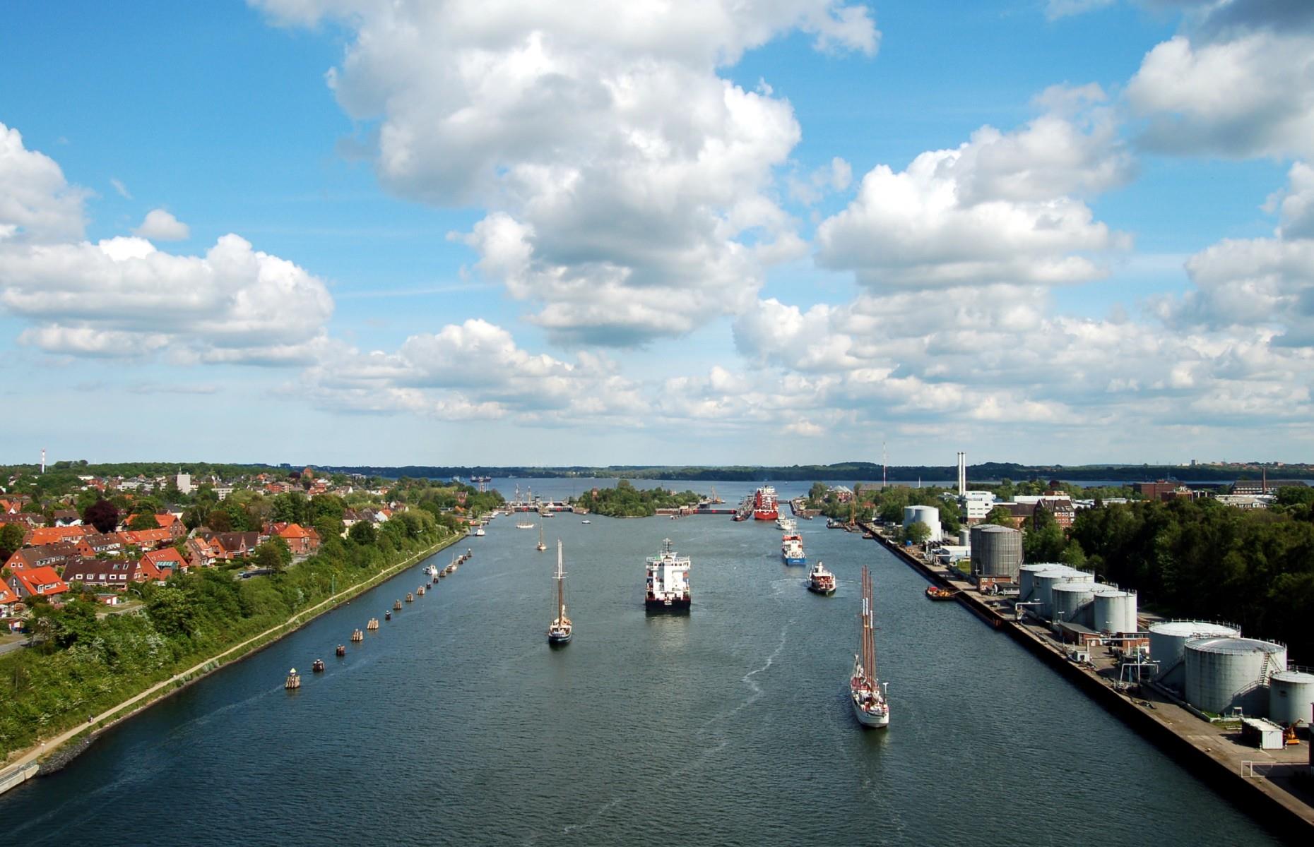 <p>Considered the busiest artificial waterway in the world, Germany’s mighty Kiel Canal trails between Brunsbuttelkoog on the North Sea to Holtenau on the Baltic Sea. Originally named the Kaiser-Wilhelm Canal, the waterway was built in the late 19th century and initially served the German military so ships would avoid having to travel northward around the Dutch peninsula. Extended in 1914 to meet the demand of naval traffic, the canal was later internationalized under the Treaty of Versailles after the First World War. Today, the Kiel Canal continues to be one of the world's most important waterways. </p>