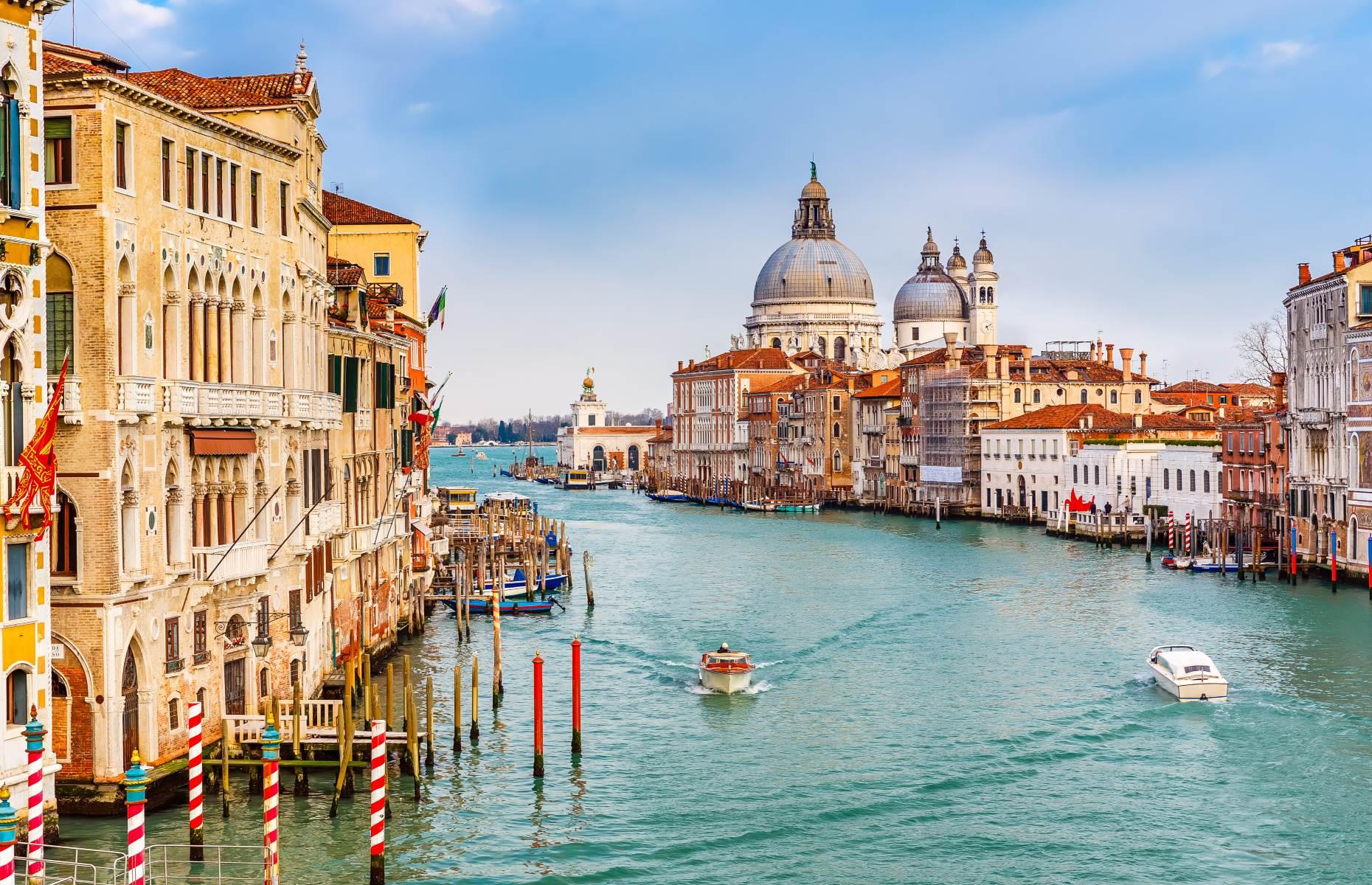 <p>Probably the most famous waterway of them all, <a href="https://www.loveexploring.com/guides/84377/explore-venice-top-things-to-see-and-do-best-hotels-and-where-to-eat">Venice</a>’s Grand Canal snakes through the heart of the famous floating city. The canal functions as the city’s main transportation source as the use of automobiles is strictly prohibited. At just over two miles (3km), the Grand Canal is like the main artery of Venice, separating it into two, and is surrounded by some of the city’s most famous landmarks. Crossing the water, the lavish Rialto Bridge is one of the main attractions, completed in 1591, it is the canal's oldest bridge.</p>