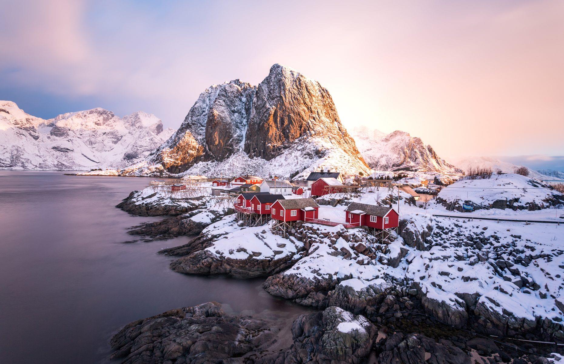 Draped in snow and bathed in violet-tinged sunlight in this photograph, Hamnøy’s colorful wooden houses, stacked onto the cliffs on stilts, certainly look like the stuff of fantasy. Located on its own small island in Norway’s Lofoten Islands, Hamnøy started life as a fishing village some 1,000 years ago. Wooden cabins were used to house fishermen when they came to visit for an annual fishing event – the oldest that still stand today date back to 1890.