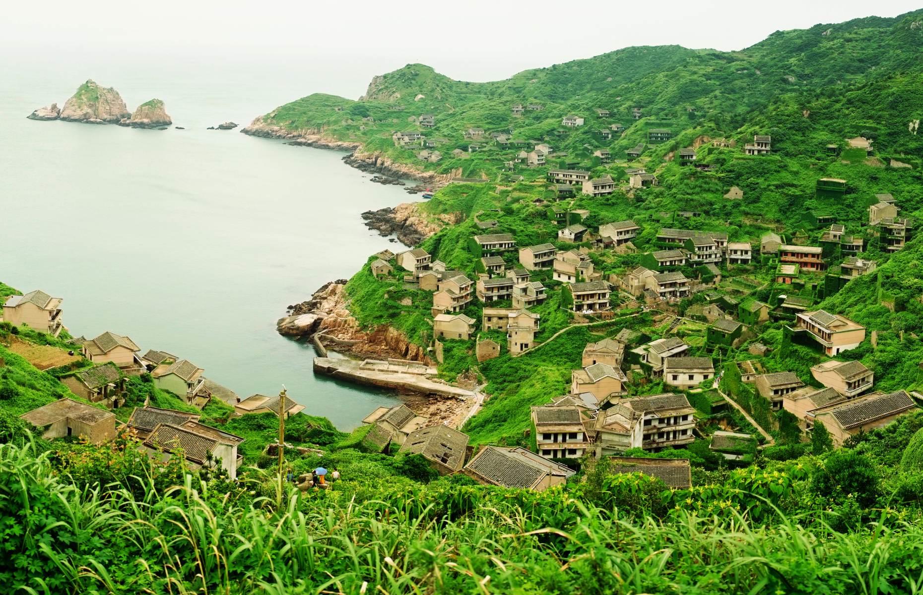All but abandoned in the 1990s, the remote fishing village of Houtouwan, located on Shengshan Island off the east coast of China, has since become overgrown with ivy and foliage. With its intriguing green-carpeted buildings blending into the hillsides, it almost looks as if it’s been swallowed up by the land. While Houtouwan is largely deserted, a small number of its former population remains, making an income from intrepid tourists who come to visit.