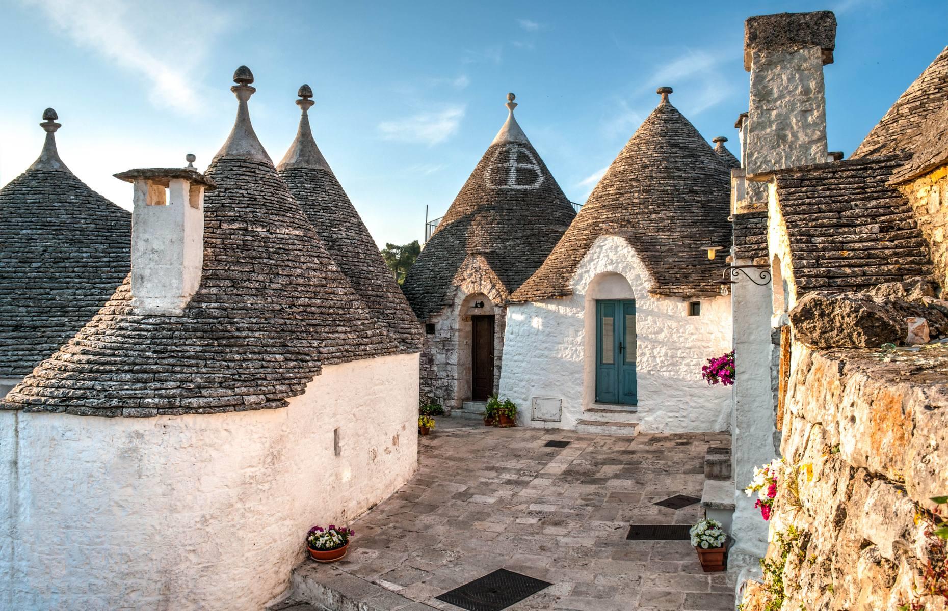 The conical-roofed, whitewashed houses of Albarello look like they’d be better suited to mythical creatures than human beings. Located in southern Italy’s Puglia region, just at the top of the boot’s heel, the town is best known for these traditional trulli buildings today. They were constructed from local limestone using a prehistoric building technique, with the oldest ones dating back to the 14th century.