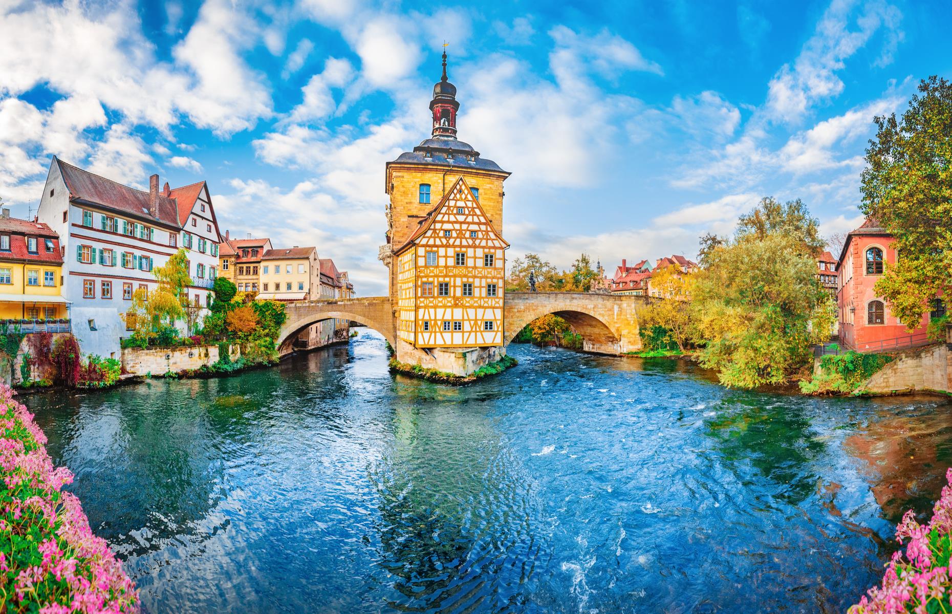 <p>Towns don’t come much prettier than this Bavarian beauty. In the north of the region, <a href="http://whc.unesco.org/en/list/624">Bamberg</a> has some perfectly preserved structures sweeping from the 11th to 19th centuries and had a huge architectural influence in Germany and beyond. Unsurprisingly, given its beauty, it attracted some great writers and philosophers and was a center of Enlightenment. Highlights include the Romanesque-Gothic cathedral, the Baroque New Palace and the medieval stone bridges that lead to Altes Rathaus (the old town hall), on an artificial island.</p>  <p><a href="https://www.loveexploring.com/gallerylist/83040/germanys-most-beautiful-towns-and-villages"><strong>See more of Germany's most beautiful towns and villages here</strong></a></p>