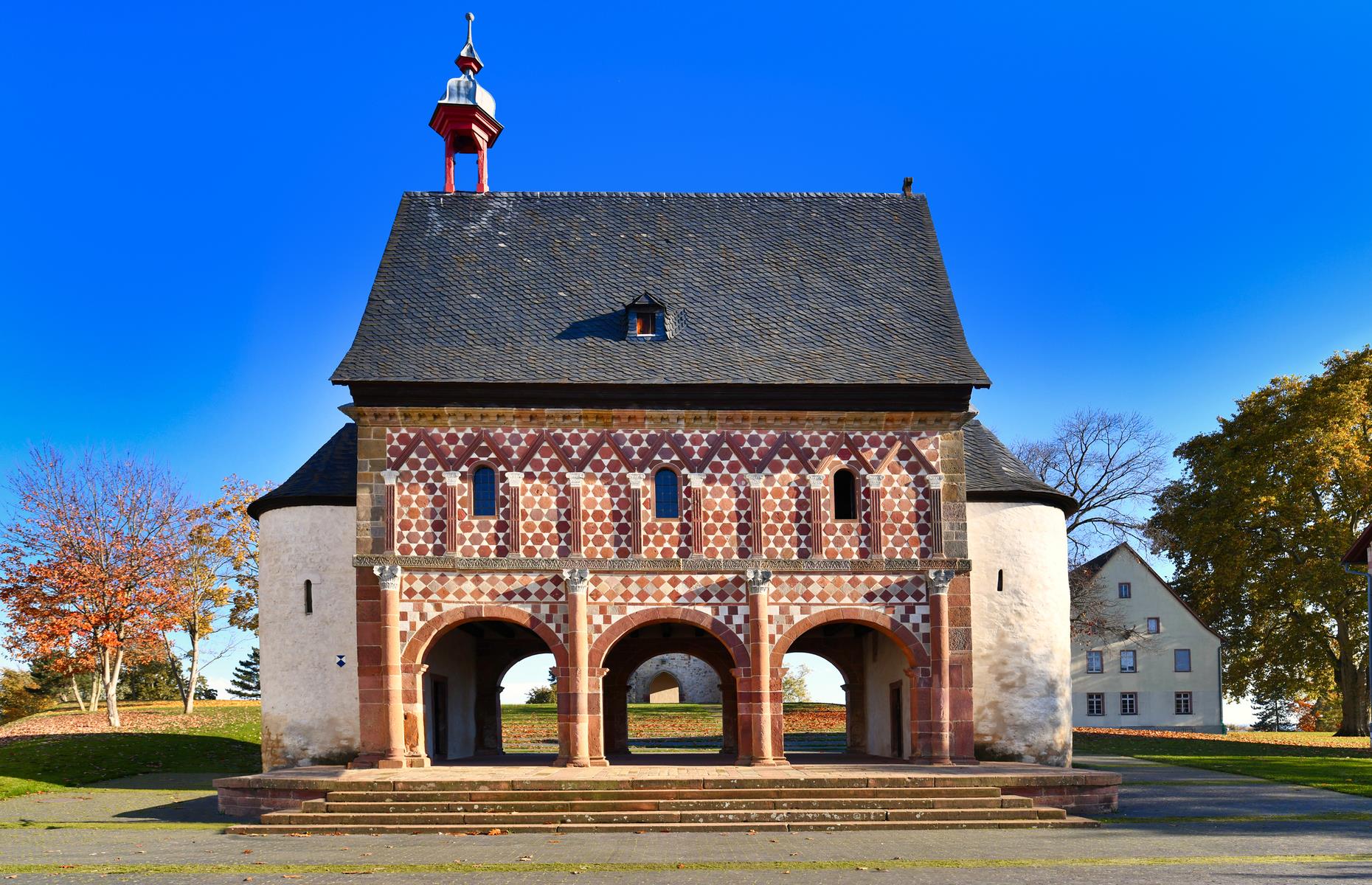 <p>The imposing gatehouse is the standout feature of <a href="http://whc.unesco.org/en/list/515">Lorsch Abbey</a>, a church and monastery founded in 764 and one of the finest surviving monuments from Germany’s early medieval Carolingian Renaissance period. The entryway is more than 1,200 years old yet wears its age remarkably well, with its archways, turrets and pitched roof impeccably preserved. Though other parts of the site have been ravaged by time and fire damage, much remains intact as a chronicler of monastic life.</p>