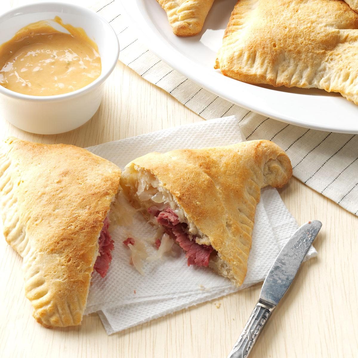 <p>I love a Reuben sandwich, so I tried the fillings in a pizza pocket instead of on rye bread. This hand-held dinner is a big winner at our house. —Nickie Frye, Evansville, Indiana </p> <div class="listicle-page__cta-button"><a href='https://www.tasteofhome.com/recipes/reuben-calzones/'>Get Recipe</a></div>