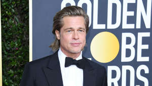 a man wearing a suit and tie standing in front of a sign: When Brad Pitt won the Golden Globe for best supporting actor for his role in ‘12 Monkeys’ in 1996, he took the opportunity to thank a rather strange source. Rather than giving a mention to his director, co-stars, or even then-girlfriend Gwyneth Paltrow, the actor thanked “the makers of Kaopectate,” a medication that treats indigestion and upset stomachs. “I have a nervous stomach, and it works. I'll be expecting those calls from Kaopectate any minute now,” Pitt explained later.