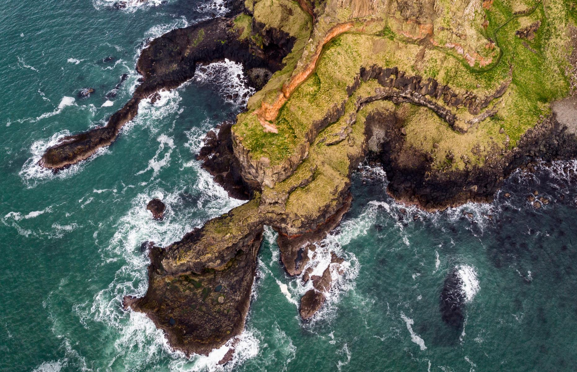 Few locations on Earth have quite such rugged charm as Northern Ireland’s Causeway Coast, a glorious stretch of coastline encompassing impressive landforms, medieval castles and cliff-side roads – as well as the famous Giant’s Causeway. In this aerial photograph, the region’s elemental beauty is captured in its dark basalt rock and crashing waves.