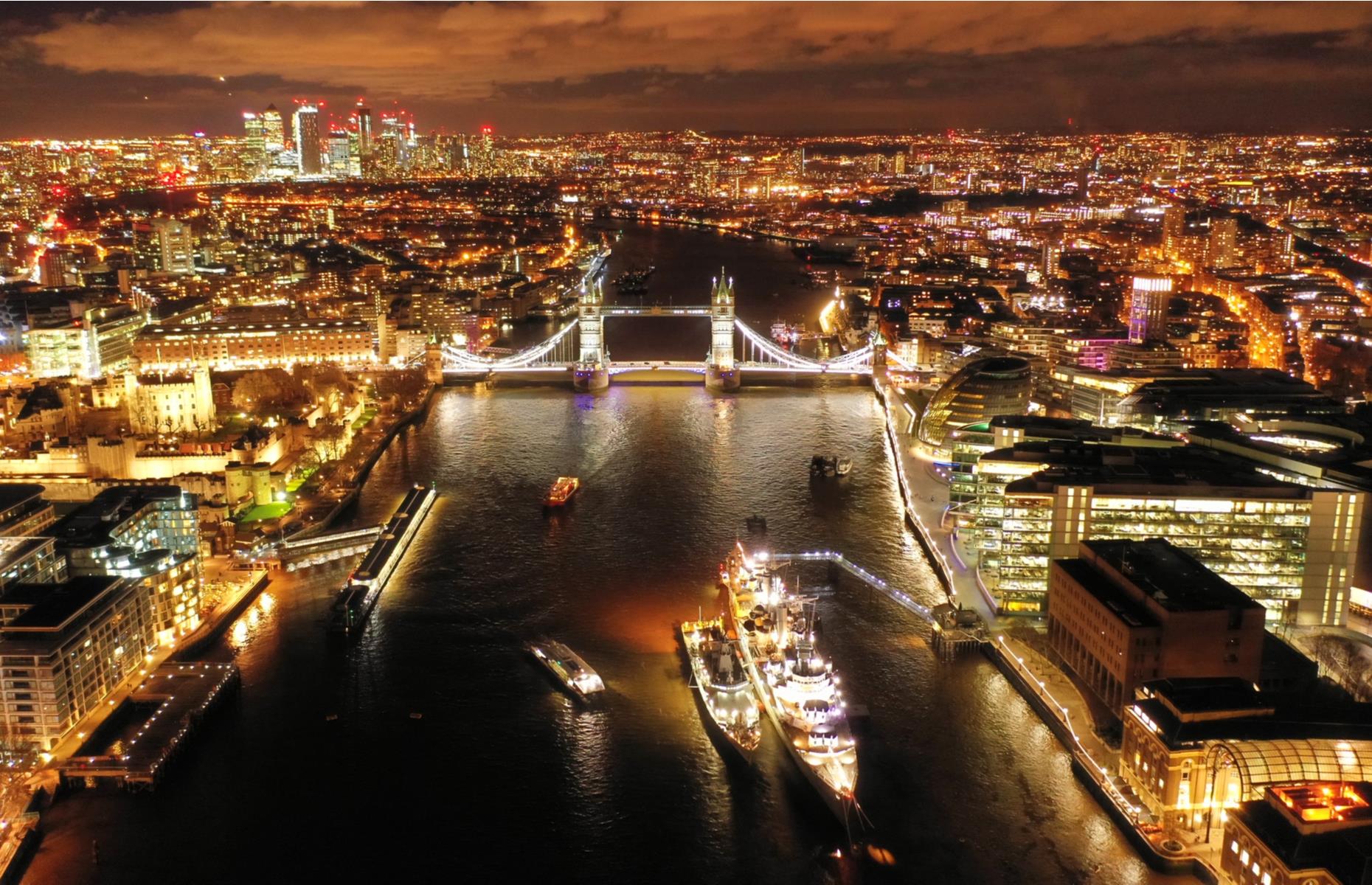 London’s iconic Tower Bridge was built at the end of the 19th century as a result of an open competition that saw more than 50 designs submitted. The winning entry, which consists of a high-level and low-level walkway sandwiched between two neo-Gothic towers, has become a beloved part of the city’s skyline ever since. Seen from a drone-eye view in this night-time photograph, the cityscape is a seamless fusion of old and new.