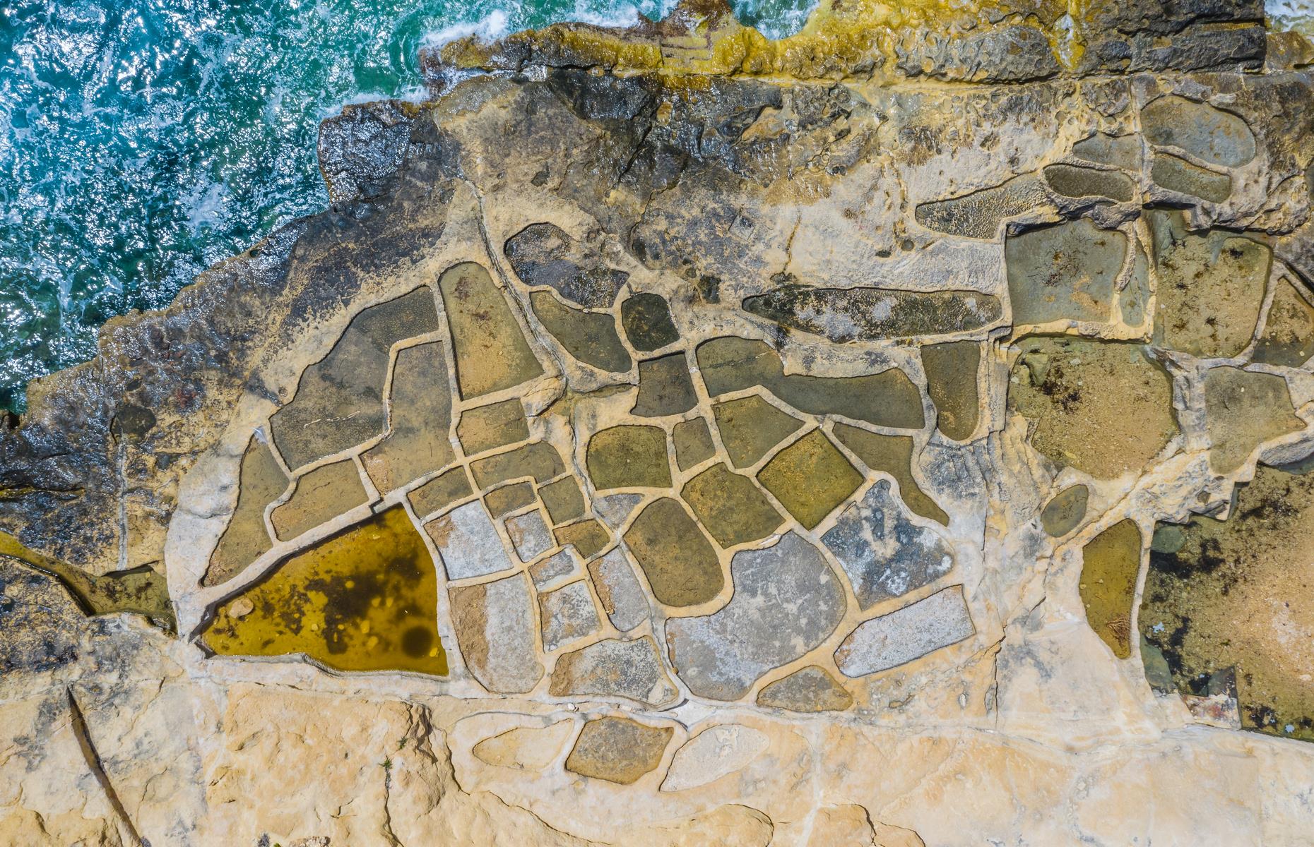 An intricate mosaic of shimmering pools, Gozo’s 350-year-old salt pans are thought to be some of the world’s oldest. Salt is formed when seawater enters the pans, is left to settle for eight days and is then moved further from the sea – where the pans are warmer – before drying up and forming salt crystals. In this stunning aerial photograph, the salt pans are a kaleidoscope of earthy tones lapped by crystal-like waters.