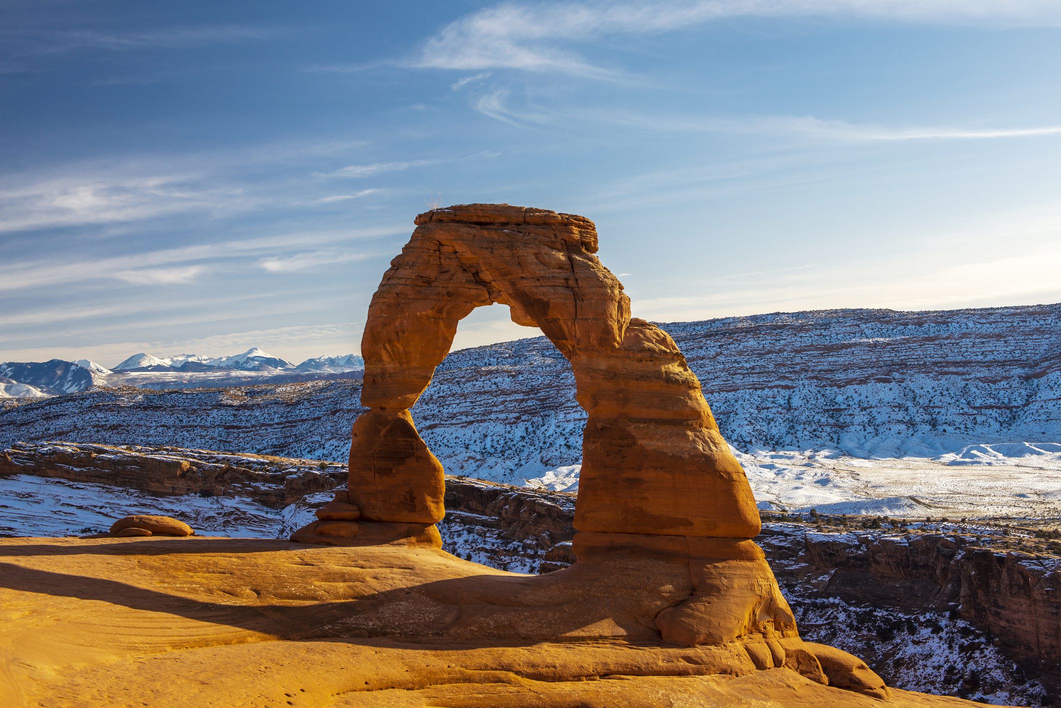 <p>Delicate Arch, the largest free-standing arch in Arches National Park, is even more stunning against a backdrop of snowy ridges. As long as conditions permit, the strenuous hike to the landmark is stunning in winter, with a little more solitude and manageable temperatures.</p><br><p><b>Related:</b> <a href="https://blog.cheapism.com/american-west-photos/">Stunning Photos of Iconic Landscapes in the American West</a></p>