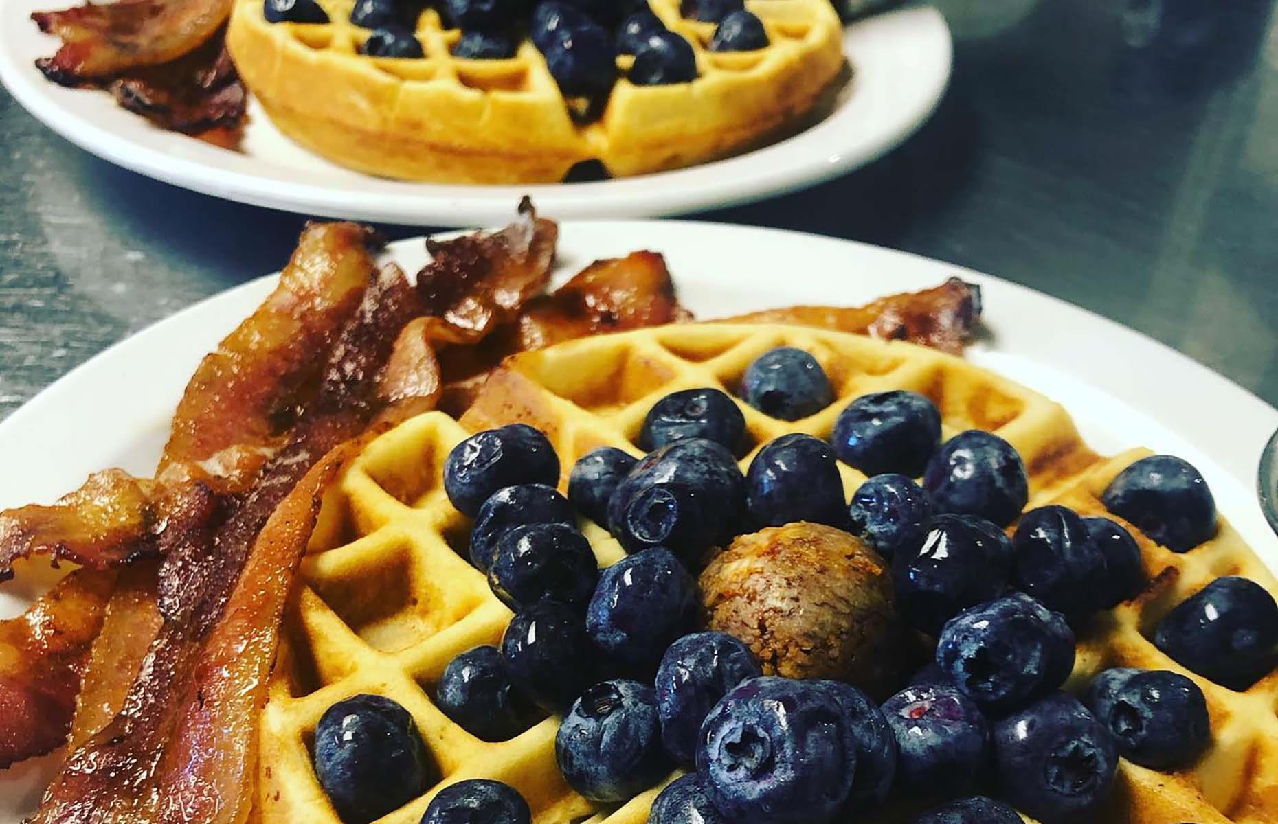<p>Opened by Lori and Jeffrey Withrow in 2018, <a href="https://www.woodironeatery.com/">Wood Iron Eatery</a> is an adorable café serving great waffles with myriad toppings, from honeycomb butter to bacon and aged Cheddar, and a crispy chicken sandwich with sriracha and pickles that puts Chick-fil-A to shame. The coffee here is also exceptional and goes extremely well with a slice of the <a href="https://www.yelp.com/biz/wood-iron-eatery-fayetteville-2">"best vanilla pound cake on Earth"</a>.</p>
