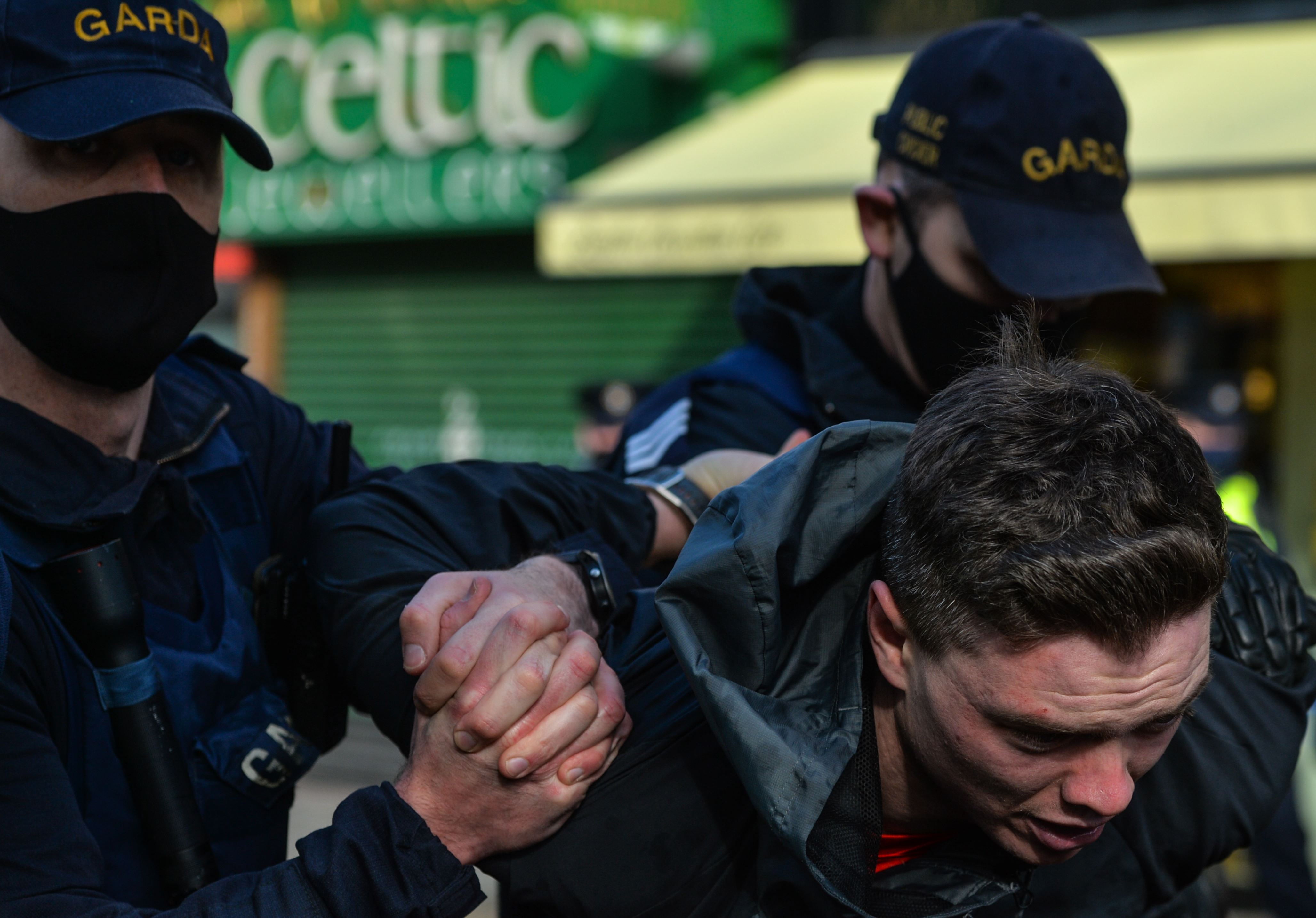 An Anti-Lockdown protester arrested by Gardai during clashes in Grafton Street, Dublin, during Level 5 Covid-19 lockdown. On Saturday, Fabruary 27, 2021, in Dublin, Ireland.