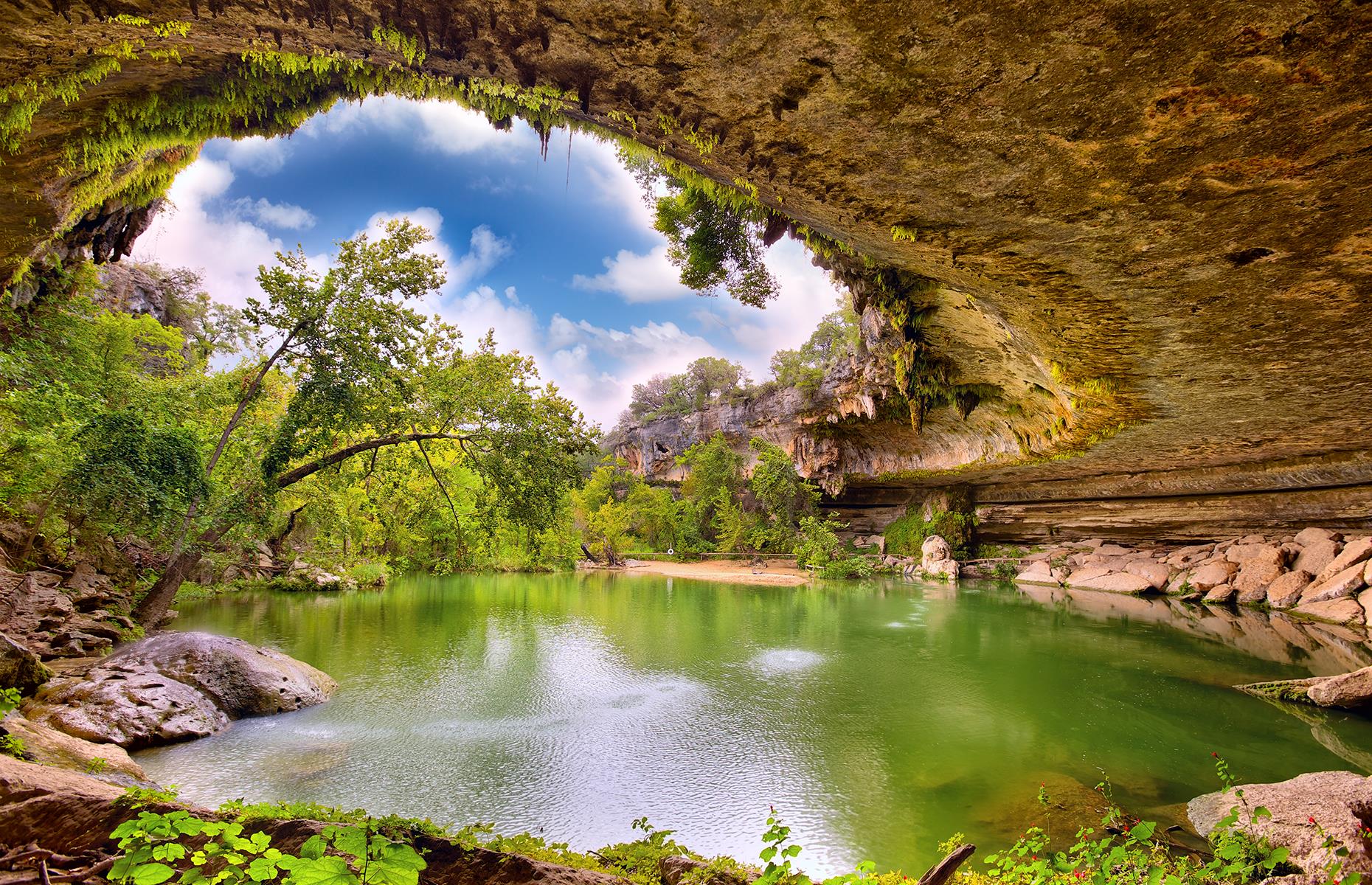 <p>Normally popular with Austin locals in summer, Hamilton Pool Preserve is a natural swimming hole just 30 miles (48km) west of the Texas state capital. The bright green pool, fed by a 50-foot (15m) waterfall, was once entirely underground until the sheltering limestone roof above it collapsed. Usually, swimming is allowed between May and September, and visitors <a href="https://parks.traviscountytx.gov/parks/hamilton-pool-preserve">need to make a reservation</a> online.</p>  <p><strong><a href="https://www.loveexploring.com/galleries/87438/americas-most-stunning-lakes?page=1">Read more about America's most stunning lakes</a></strong></p>