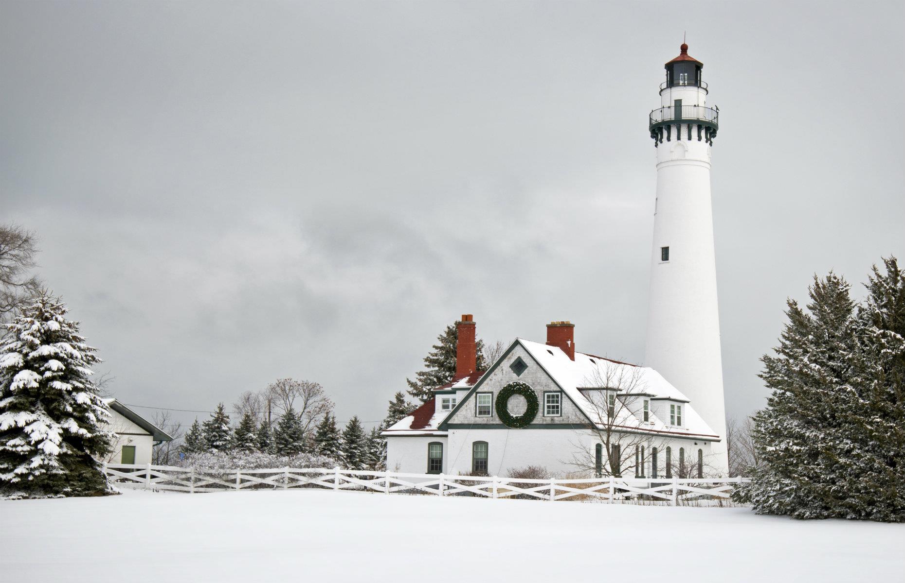 <p>Looking ultra-atmospheric in this wintry shot, the 108-foot (32m) tall Wind Point Lighthouse on Lake Michigan is one of the tallest and oldest in the Great Lakes region. It was first lit in 1880 and originally contained huge fog horns, whose signals could be heard up to 10 miles (16km) away, as well as a huge Fresnel lens which is now kept in the Coast Guard Keepers Quarters. Listed on the National Register of Historic Places in 1980, the light is still in operation today.</p>
