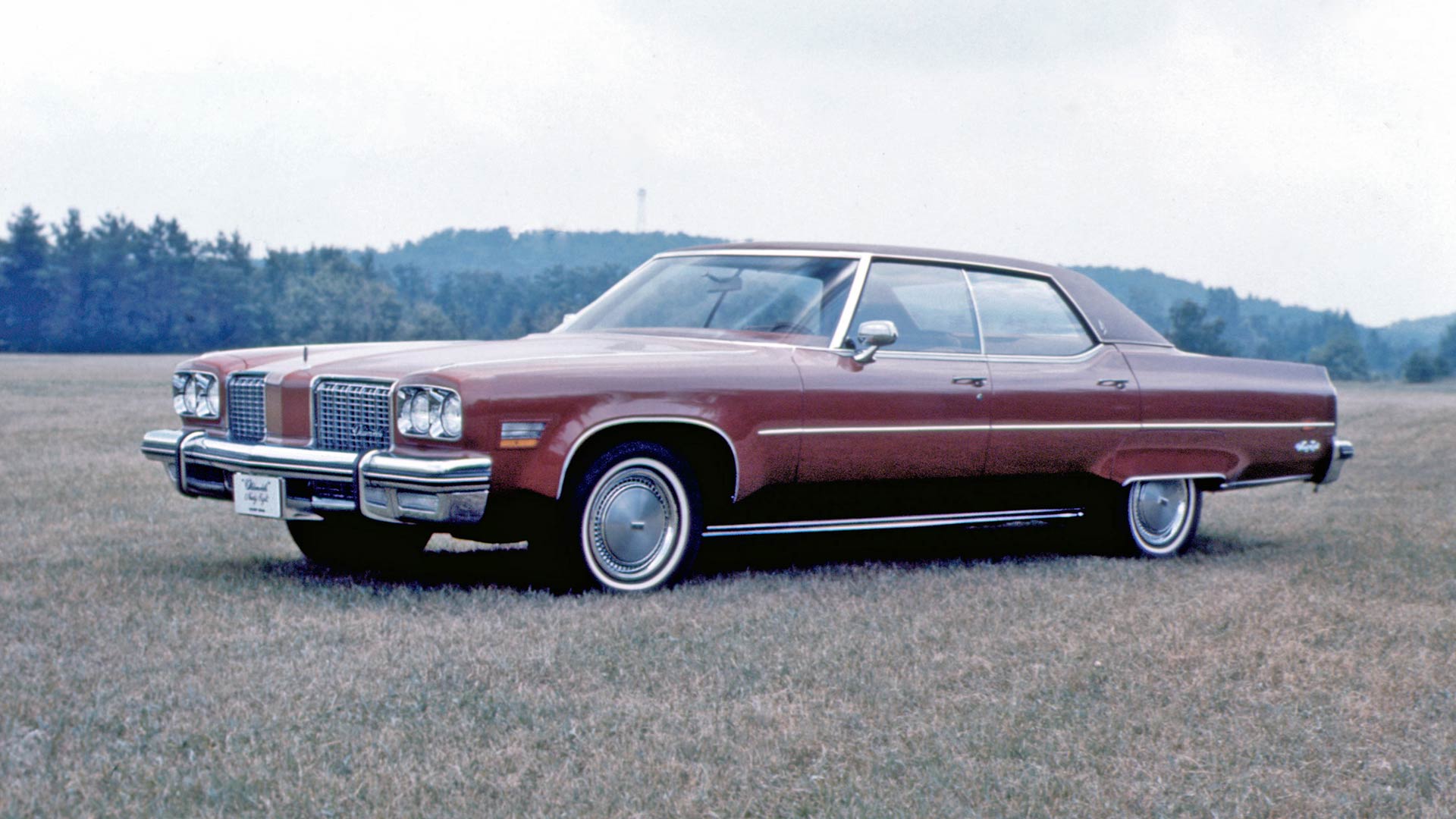 <p>Another giant of the era was the Oldsmobile Ninety-Eight. Before the marque was made to walk the plank in 2004, Oldsmobile was the oldest surviving American car brand. The glory days came in the 1970s, and with cars like the colossal 1974 Ninety-Eight it’s hard not to see why.</p> <p>Plus, any car with a 7.5-liter (455-cubic inch) V8 engine named ‘Rocket’ gains some serious credibility. The record length for ‘74 models came from the need to incorporate federally mandated 5mph bumpers into the already vast design.</p>