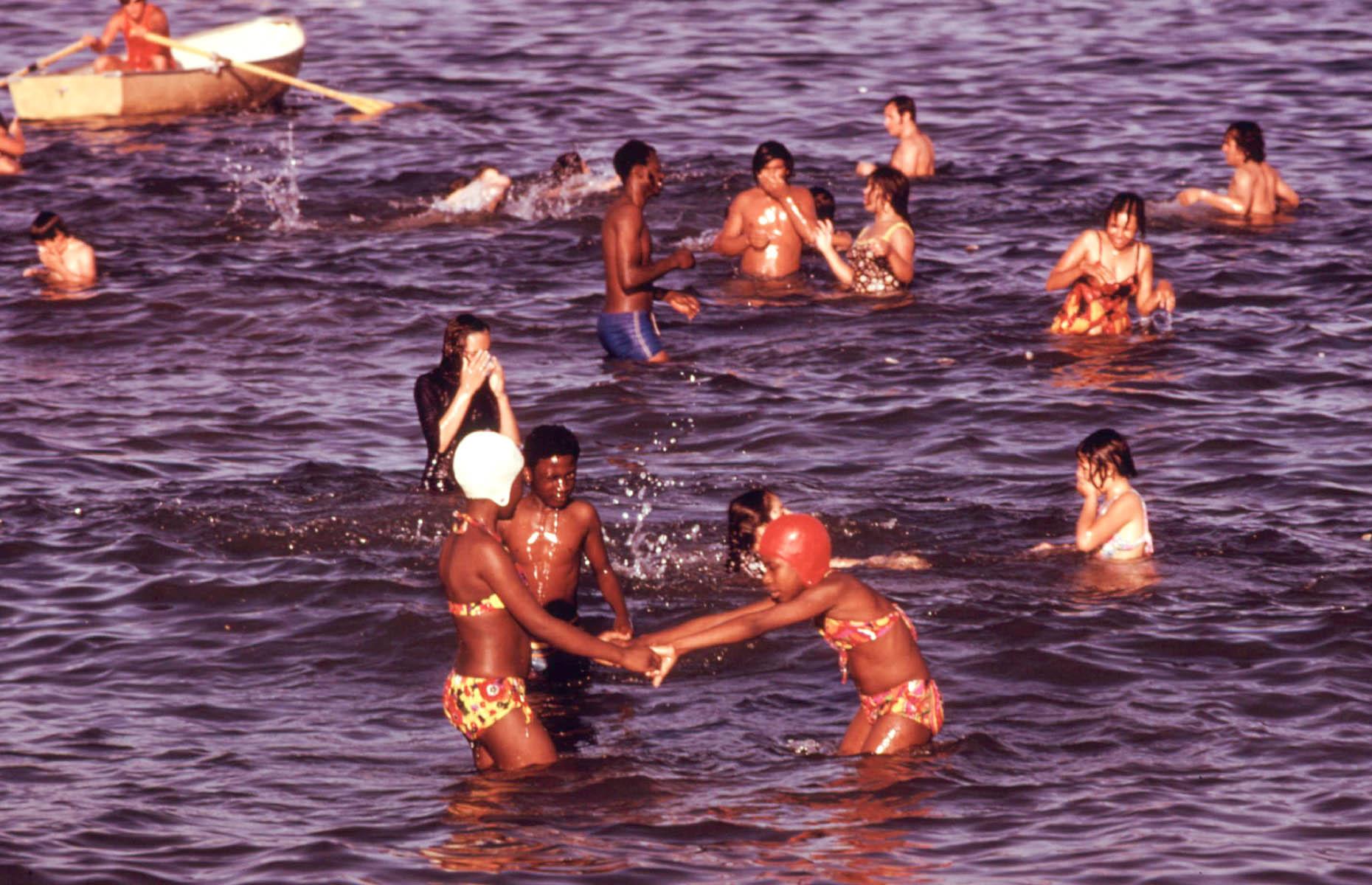 While plenty of sun-seekers made their way to the coast, others made a splash in America's Great Lakes. This 1973 shot shows youngsters swimming and paddling in Lake Michigan, off Chicago's South Side shores.