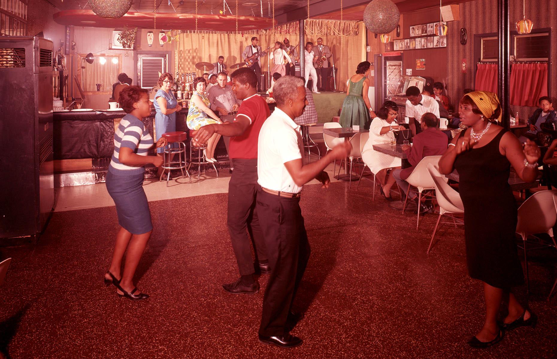 Utopia Lodge, in New York's Greenfield Park, was another popular Catskill Mountains resort. It came complete with a cocktail lounge, a pool, tennis courts and more. Here guests are photographed letting their hair down in the evening, enjoying drinks at the bar and dancing to music from a live band. The photo dates to the 1960s.